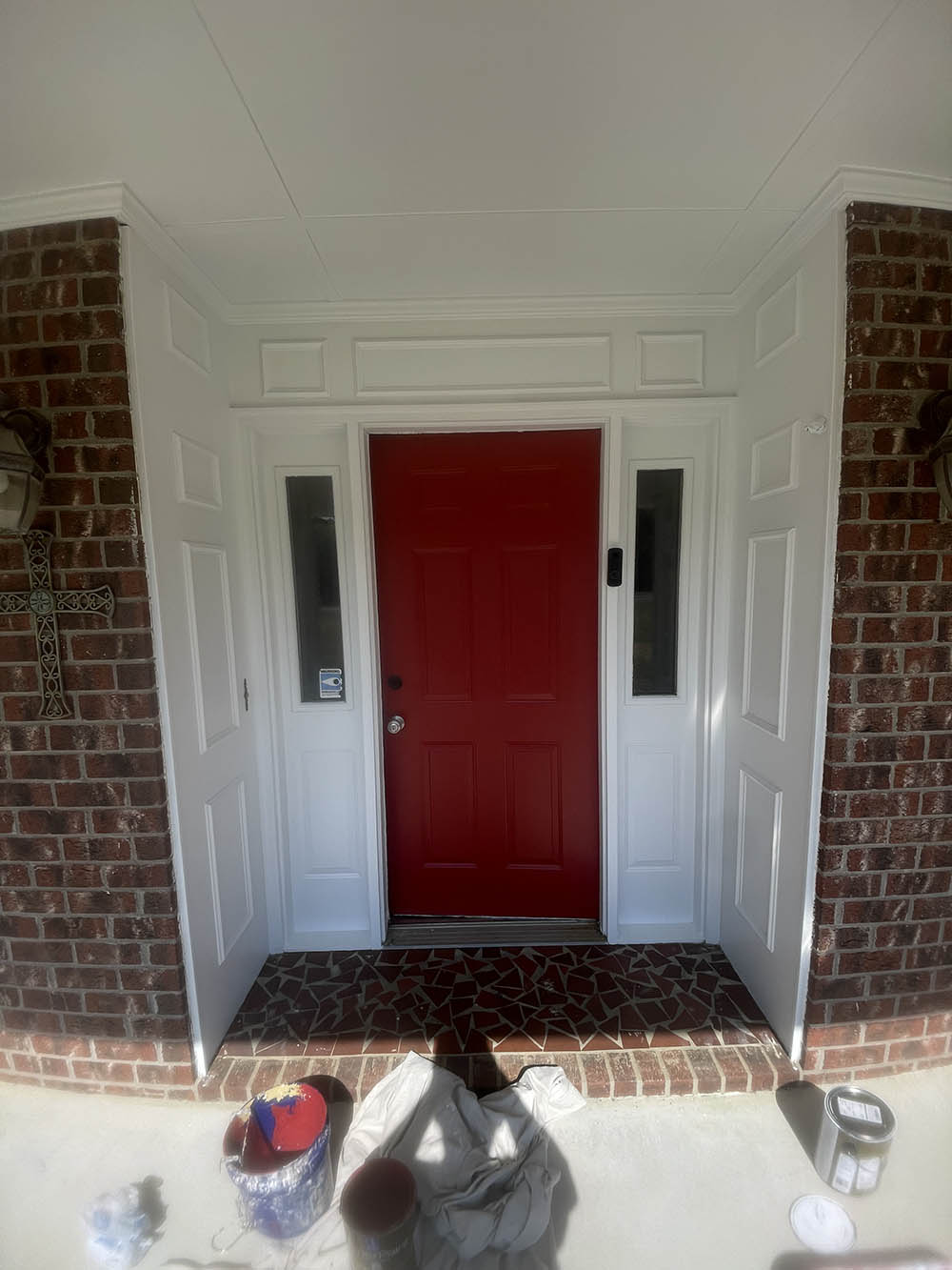 Front entryway door after being painted bright red